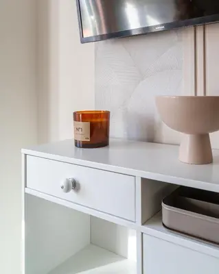 a white dresser with a bowl on top of it at Viva Valencia Apartments in Valencia
