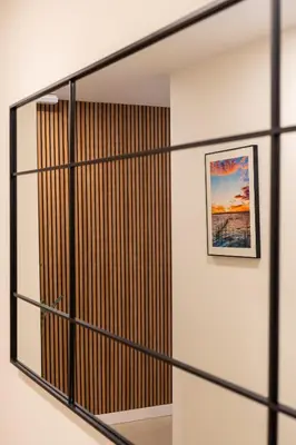 a hallway with sliding glass doors with a picture at Viva Valencia Apartments in Valencia