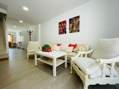 a living room with a couch and chairs and a table at JERICA ALOHA in Jérica