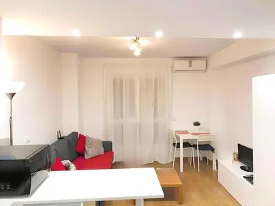 a living room with a couch and a table at Estudio en el Corazón de Valencia al lado Catedral in Valencia