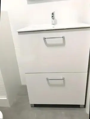 a white kitchen with a sink and a counter at Estudio en el Corazón de Valencia al lado Catedral in Valencia