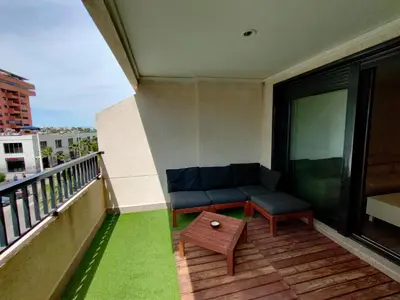 a balcony with a couch and a table at NON STRESS First Level in Valencia