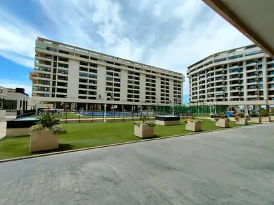 two large buildings with potted plants in a courtyard at NON STRESS First Level in Valencia