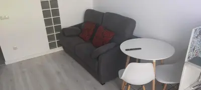 a living room with a couch and a table at valencialoft in Valencia
