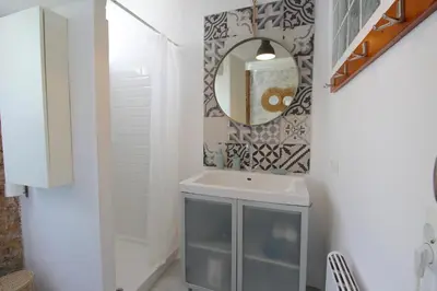 a bathroom with a sink and a mirror at Piso en el Carmen cerca del Mercado Central in Valencia