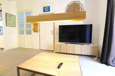 a living room with a large flat screen tv at Piso en el Carmen cerca del Mercado Central in Valencia