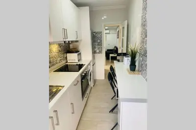 a kitchen with white cabinets and a counter top at VALENCIA / PLAYA CABANYAL, PUERTO, CUIDAD ARTES in Valencia