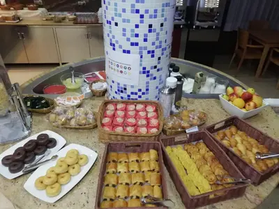 a table topped with trays of different types of food at Hotel Vent de Mar in Puerto de Sagunto