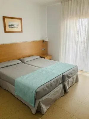 a bedroom with a large bed in a room at Hotel Vent de Mar in Puerto de Sagunto
