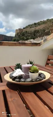 a plate of food on a table on a balcony at El Enclave in Chulilla