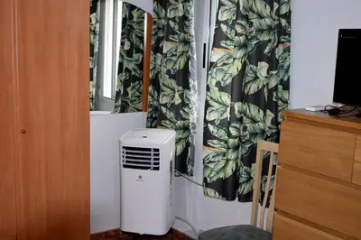 a room with a air conditioner next to a window at FLAMING 2 in Cullera