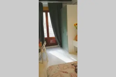 a living room with a mirror and a door at Precioso Apartamento frente del Mercado Central in Valencia