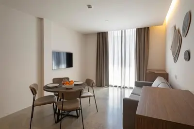 a living room with a couch and a table and chairs at Dau Studios in Valencia