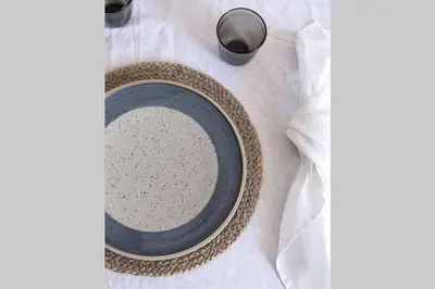 a plate and a bottle of milk on a table at UIM Mediterraneo Poeta 5 Wifi in Puerto de Sagunto