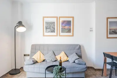 a living room with a couch and a table at Maritim Horizon House Port of Valencia in Valencia