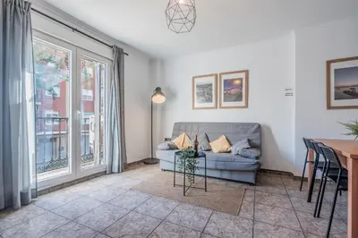 a living room with a couch and a table at Maritim Horizon House Port of Valencia in Valencia