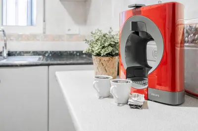 a coffee maker on a counter in a kitchen at Maritim Horizon House Port of Valencia in Valencia
