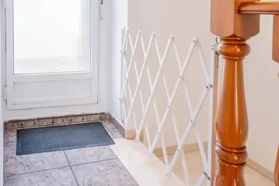 a hallway with a white door and a window at Maritim Horizon House Port of Valencia in Valencia