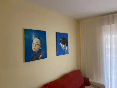 three pictures on the wall of a living room at Nova Almenara. Ideal para familias in Barrio-Mar