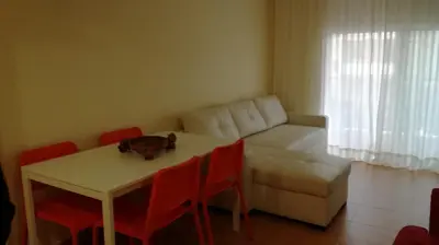a living room with a table and a couch at Nova Almenara. Ideal para familias in Barrio-Mar