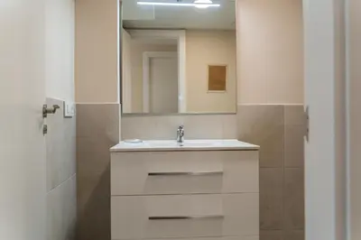 a bathroom with a sink and a mirror at MD Galán Street in Valencia