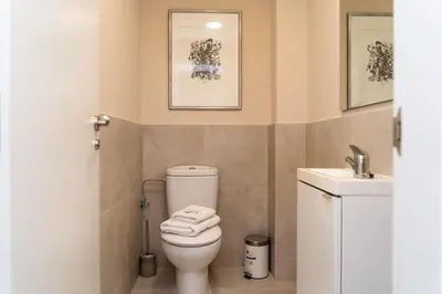 a bathroom with a toilet and a sink at MD Galán Street in Valencia