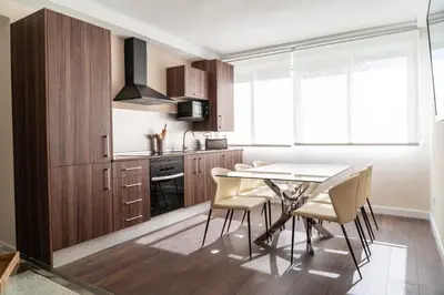 a kitchen with a dining room table and chairs at MD Galán Street in Valencia