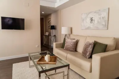 a living room with a couch and a table at MD Galán Street in Valencia