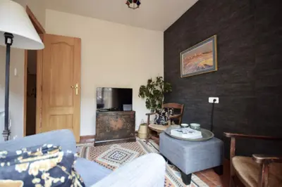 a living room with a couch and a table at Casa El Cielo, in the heart of Old Town in Chulilla