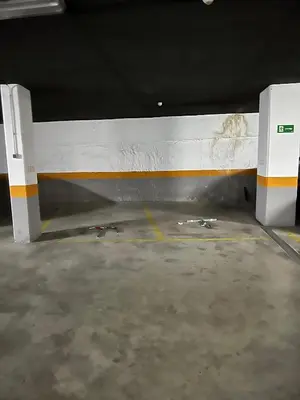 a room with a white and orange wall in a garage at BioHomeValencia in Valencia