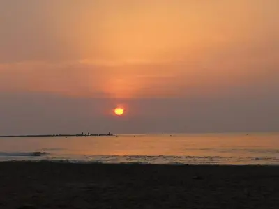 a sandy beach with the ocean in the background at Haus LIDZBARSKI in Burriana