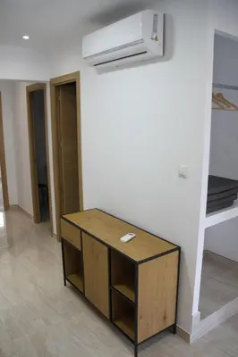 a mirror on a wall next to a door at Haus LIDZBARSKI in Burriana