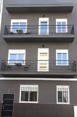 a room with tables and chairs and an umbrella at Haus LIDZBARSKI in Burriana