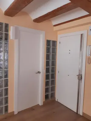two doors in a room with wine bottles at Lepanto Centro Valencia1 in Valencia