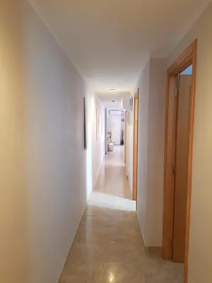 an empty hallway with white walls and a long hallway at SUN&BEACH Moncofar in Moncófar