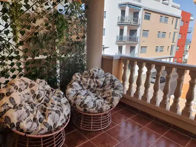 two baskets sitting on a balcony next to a building at SUN&BEACH Moncofar in Moncófar