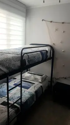 two bunk beds in a room with a window at SUN&BEACH Moncofar in Moncófar