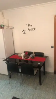 a ping pong table in the corner of a room at habitación pequeña en piso compartido con 2 adultos in Valencia