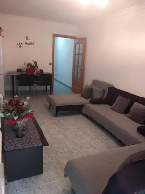 a living room with two couches and a piano at habitación pequeña en piso compartido con 2 adultos in Valencia