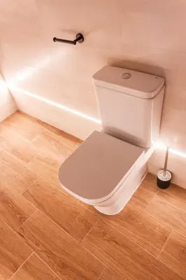 a white toilet in a bathroom with a tub at Marittimo Apartments in Valencia