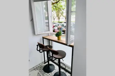 a room with a table and two stools at Arenas beach 3 in Valencia