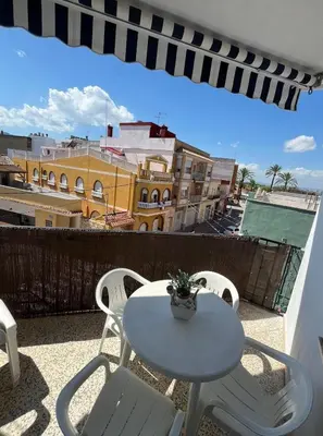 a white table and chairs on a balcony at Aitana in Fortaleny
