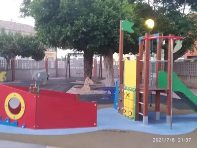a playground with a slide in a park at Aitana in Fortaleny