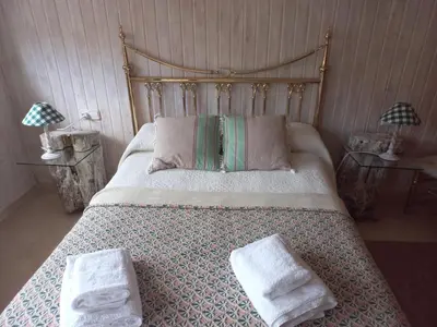 a bedroom with a bed with two towels on it at Casa MUNDOVALENCIA in Valencia
