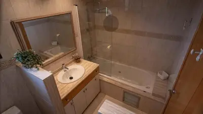 a bathroom with a sink and a shower and a tub at Casa MUNDOVALENCIA in Valencia