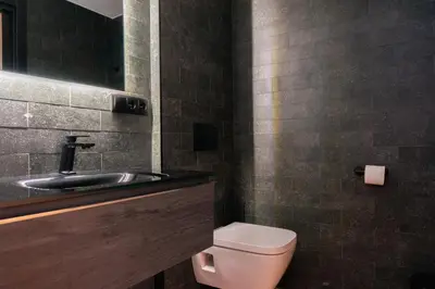 a bathroom with a toilet and a sink at Valencia Luxury - Sea Port II in Valencia