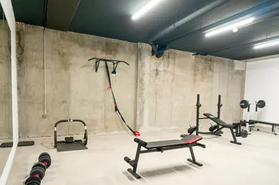 a gym with several exercise equipment in a room at Valencia Luxury - Sea Port II in Valencia