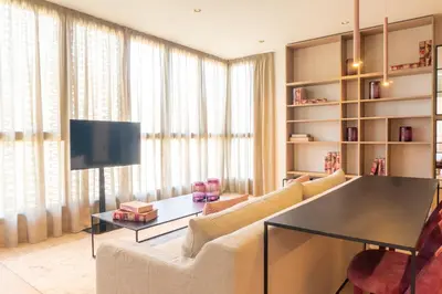 a living room with a couch and a table at Valencia Luxury - Sea Port II in Valencia