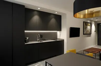 a kitchen with black cabinets and a sink at Fetén in Valencia