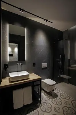 a bathroom with a sink and a toilet and a mirror at Fetén in Valencia